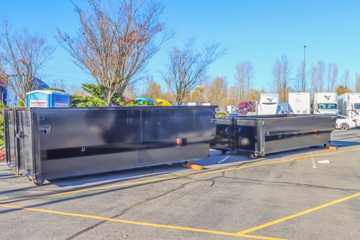 Professional dumpster rental service with roll-off container on residential driveway in Lackawanna